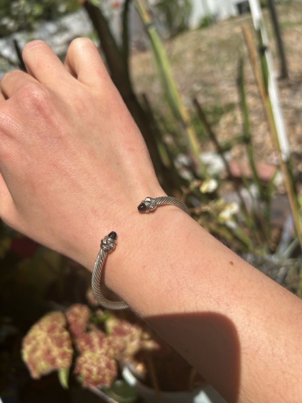 David Yurman silver twisted cable bracelet with 18k gold and black onyx details